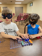 campers exploring circuit boards