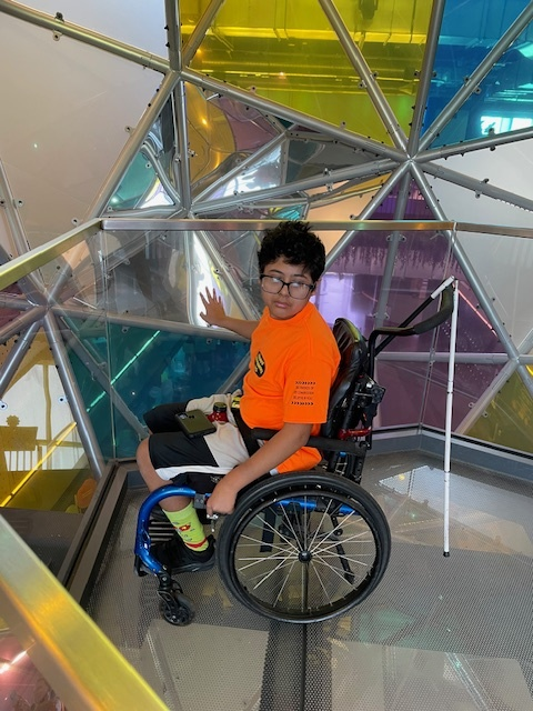 camper explores inside Kiewit Luminarium