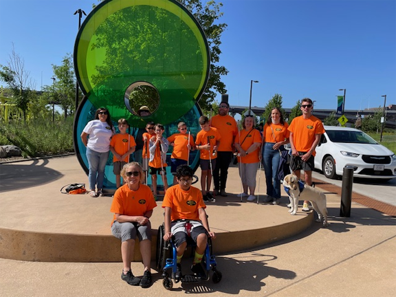 campers and staff outside the Kiewit Luminarium wearing Friends sponsored T-shirts